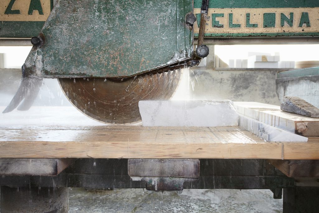 Machinery cutting stone on board